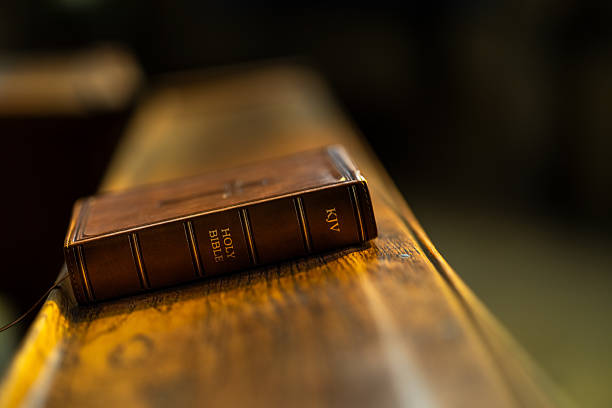 istock Leather Bible on Wooden Pew 2208978956