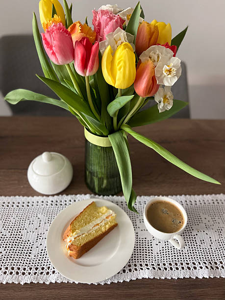 istock Delightful and Charming Breakfast Setting Decorated with Beautiful Flowers and Cake 2208986735
