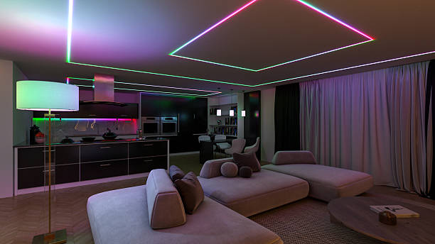 istock Modern open-concept interior blending a living room and kitchen, highlighted by vibrant RGB LED lighting outlining the ceiling 2208988465