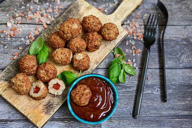 istock Mini pork meatballs with salsa filling. 2208989192