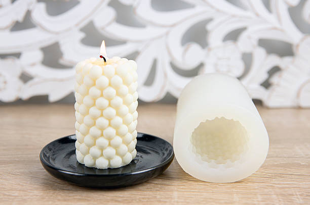 istock Scented white homemade candle made with bubble shape candle silicone mold. Molding a shape. 2208989274