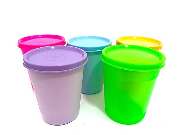 Set of five colorful plastic cups with lids