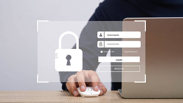 istock A close-up of a person using a mouse, with a digital lock icon on the screen, symbolizing cybersecurity and online safety practices. 2208999134
