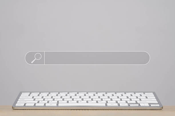 istock Minimalist workspace featuring a sleek keyboard and a blank search bar, ideal for digital communication and creative projects in modern office environments. 2208999347
