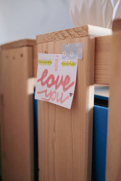 Handwritten I Love You Note on Wooden Shelf