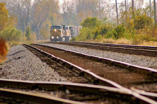 Mt. Olive, IL: A BNSF Railway train rounds a bend before passing a railroad junction of tracks in rural Mt. Olive, IL.