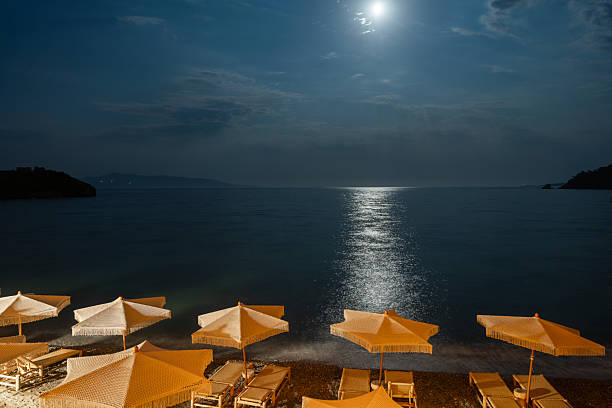Moon Sparkle Over The Sea in The Summer Night. Landscape with Moonlight Road and Mediterranean Sea