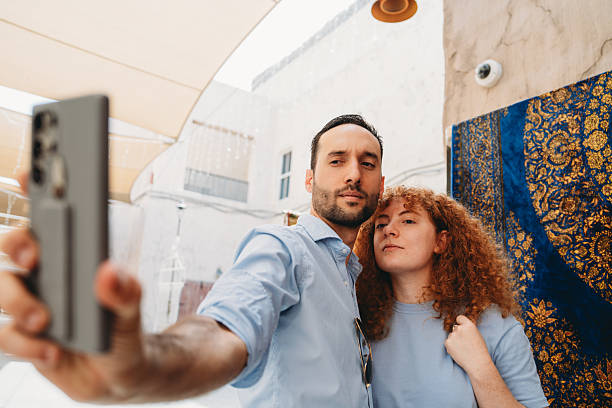 istock Tourists taking selfie in old Dubai with smartphone 2209014684