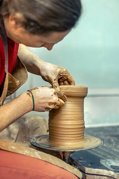 istock Master male potter making a vase. Pottery. Clay modeling. Creating ceramics. 2209016101