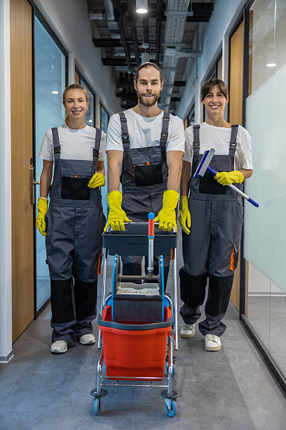 istock Group of young people in uniform going to clean the office 2209016999