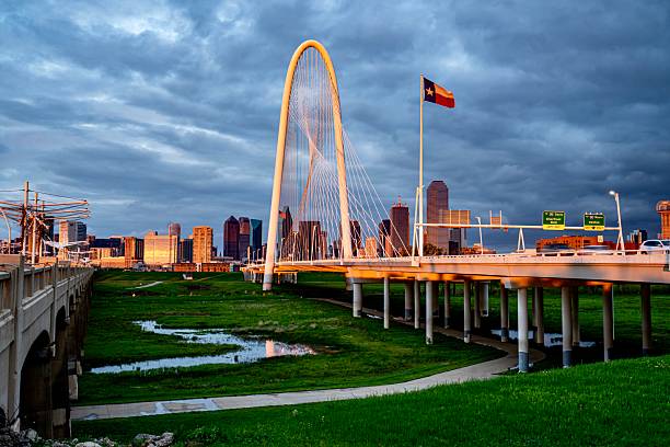 Downtown Dallas, TX behind the Margaret Hunt Bridge at Dusk