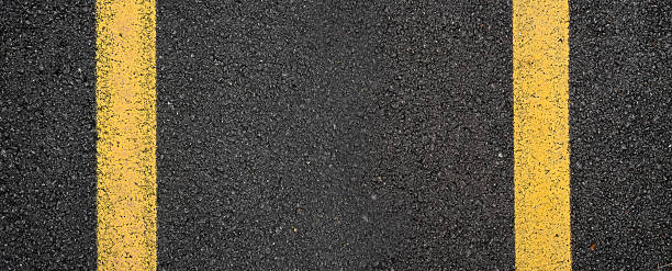 istock Close-up asphalt road texture with yellow line 2209021488