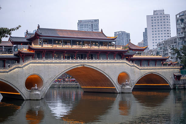 The Anshun Bridge, is a 300 year old bridge crosses the Jin River. The covered bridge contains a relatively large restaurant and is a popular eating location in the city
