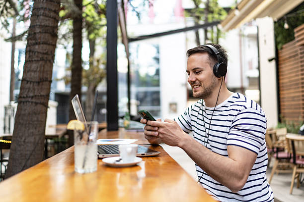 istock A Caucasian man works online from outdoors cafe 2209021591