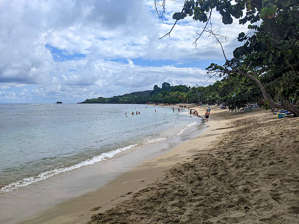 istock People Walk and Relax on a Pristine Tropical Beach With Clear Waters 2209026342