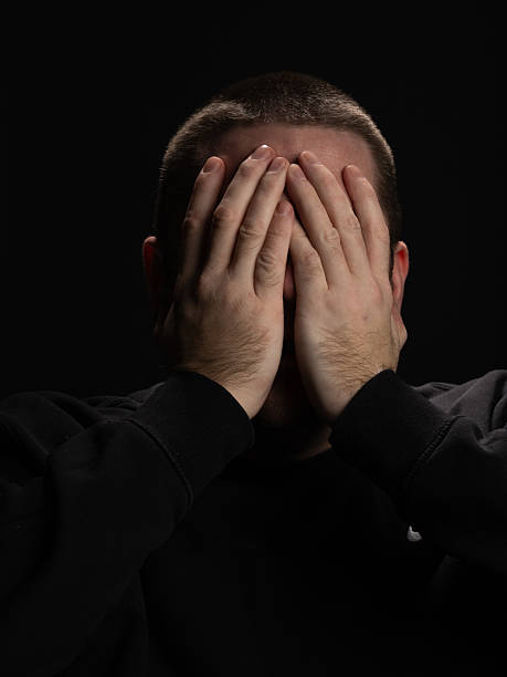 istock Man Expressing Frustration in Dramatic Portrait 2209026790