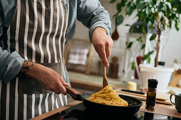 istock Close up of man making pasta in the kitchen. 2209029186
