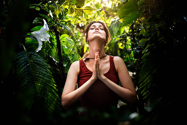Young woman meditating outdoors