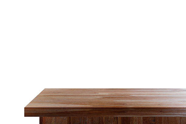 Empty wooden tabletop isolated on white background. For your product placement or montage with focus to the table top in the foreground. Empty pine wooden shelf. shelves