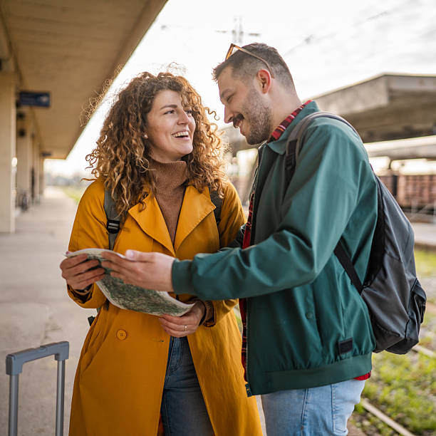 istock adult couple use map for navigation and explore on the train station 2209029949