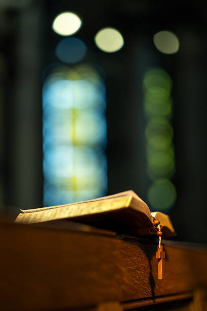 istock Open Bible on Wooden Pew 2209030926