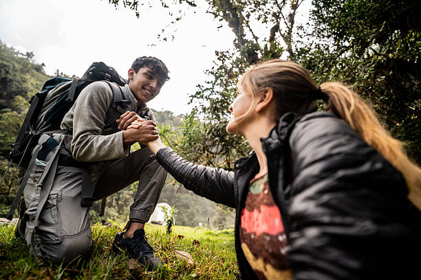 istock Friends holding hands doing trail at nature 2209034695