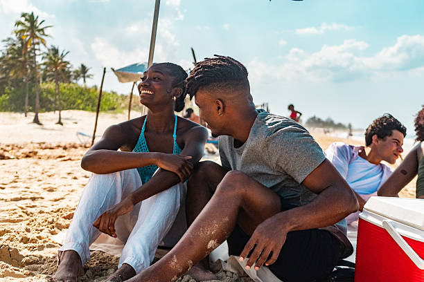 istock Young couple talking on the beach 2209035684