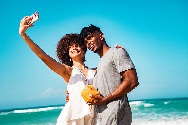 istock Young couple taking a selfie on the beach 2209035838