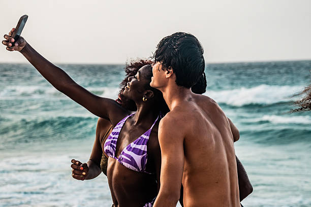 Young friends taking a selfie on the beach