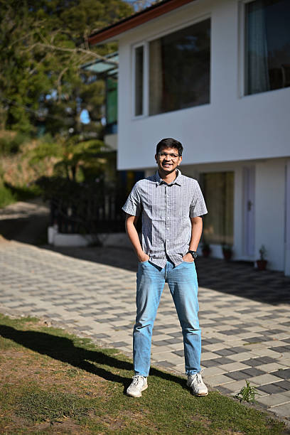 istock Portrait of a smiling young man with hands in pockets 2209036764