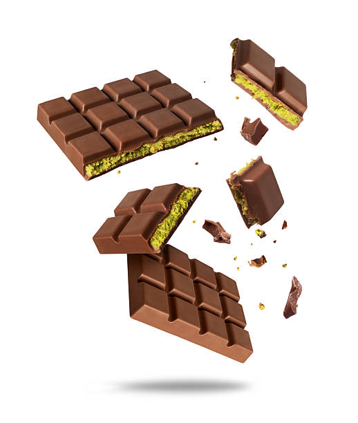 istock Broken Dubai chocolate in the air isolated on a white background. Dubai chocolate is made with pistachio paste and kadayif 2209037593