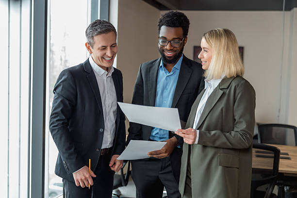 istock Group of people in the office looing contented and confident 2209038980