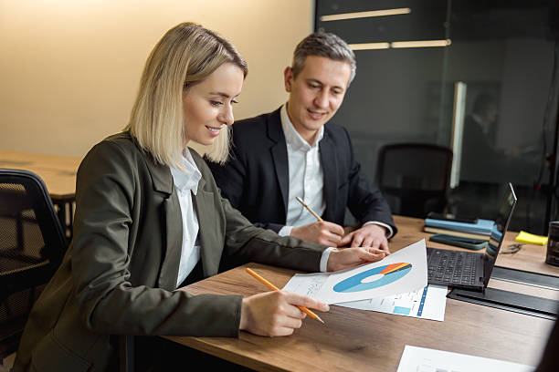 istock Business consultants working together in the office 2209039026