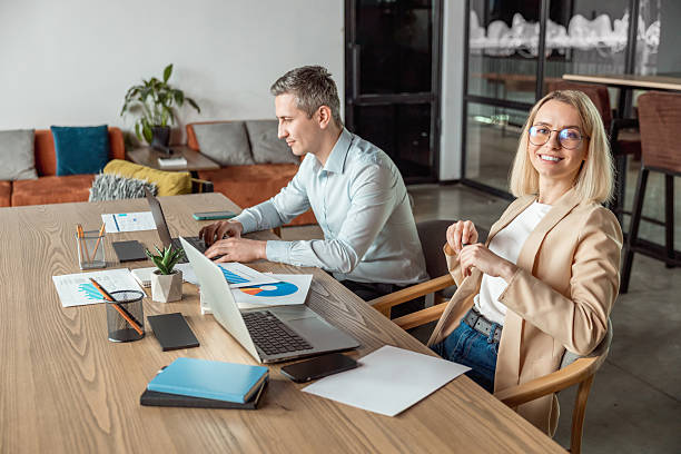 istock Layers working in the office and looking busy and contented 2209039081