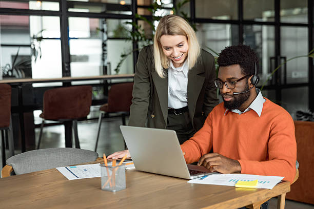 istock Two business consultants working in the office together 2209039131