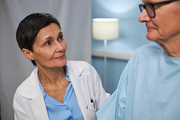 istock Caring Doctor Engaging with Senior Patient in Clinic 2209039409