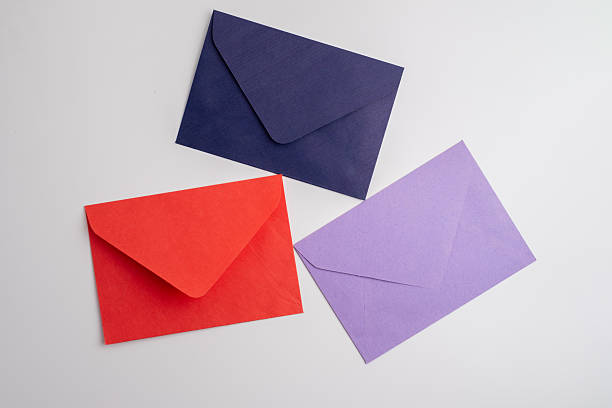 istock Paper envelopes on a light background. New mail, write a message. Send and receive mail. Postal delivery service. Empty envelope, empty space. Communication with people, paperwork. Envelope close-up 2209043789