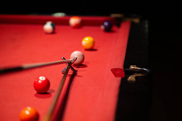 istock close up of biliard cue aiming on the table 2209044849
