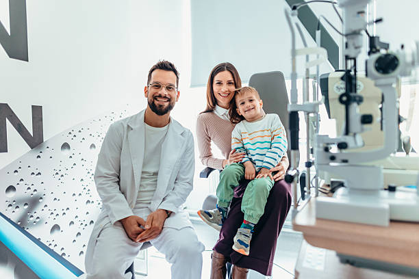 istock Happy Family Visiting an Ophthalmologist for Routine Eye Examination 2209045184