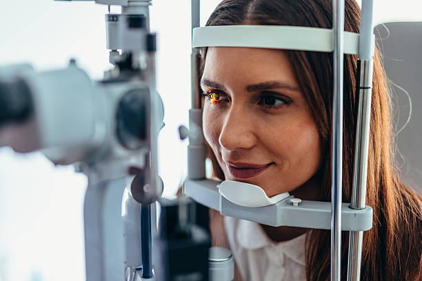 istock Woman Undergoing Eye Examination Using Modern Diagnostic Equipment at a Clinic 2209045411