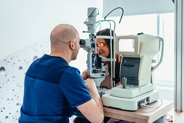 istock Optometrist Conducting Eye Examination Using Slit Lamp Technology in Clinic 2209045436