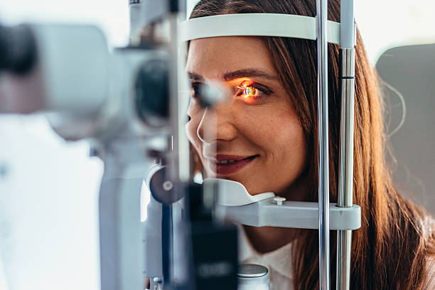 istock Woman Undergoing Eye Examination Using Advanced Optical Equipment in Clinic 2209045437