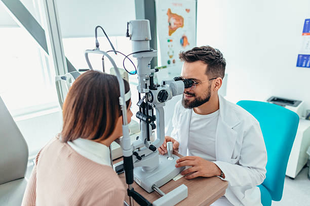 istock Optometrist Performing Eye Examination on Patient Using Ophthalmic Equipment in Clinic 2209045761