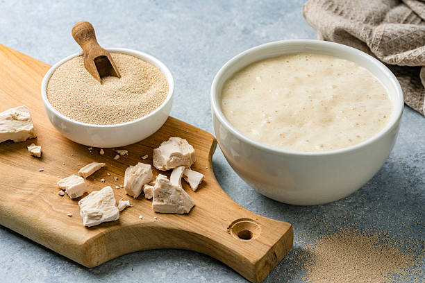 istock Fresh and dried yeast on white table 2209046994