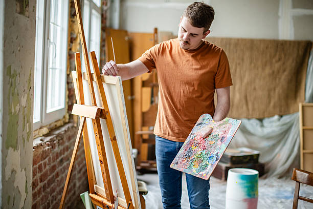 istock Creative adult artist in a studio engaging in painting and artistic exploration while enjoying a leisure activity indoors 2209048979