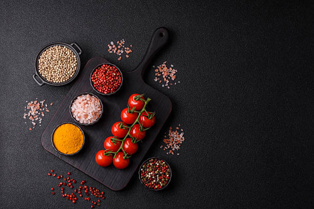istock Red cherry tomatoes on a branch, a vegetable as an ingredient for making sauces 2209049249