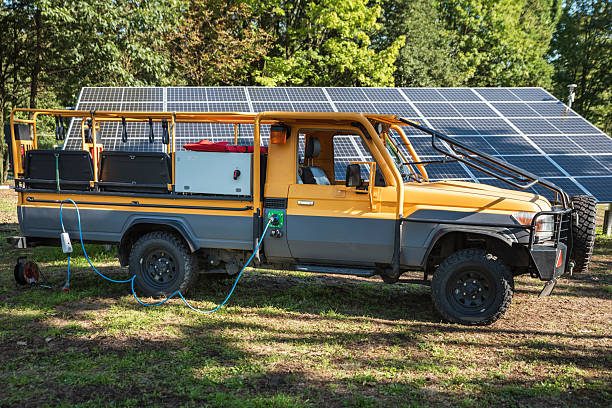 istock Off-road vehicle while charging from photovoltaic 2209049366