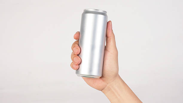istock Hand is hold A blank silver aluminum can on white background. 2209051817
