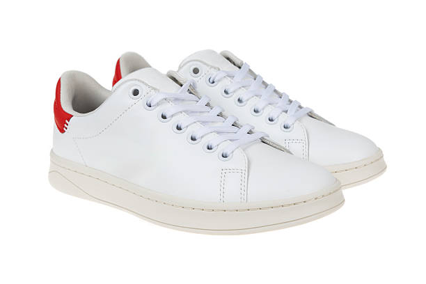 istock Pair of new white sneakers, isolated on white 2209051993