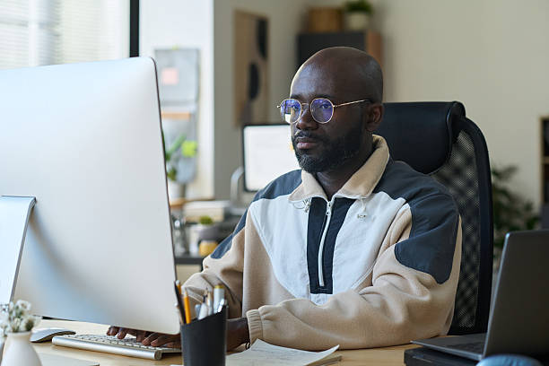 istock Young serious designer in eyeglasses 2209054368